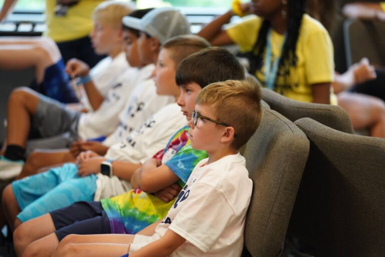 Kids sit and listen to engaging stories about Jesus from the Bible.